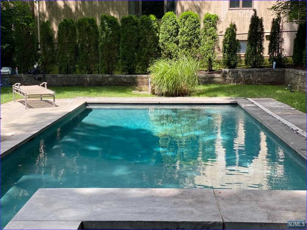 10 reasons to buy this stunningly renovated (2011/2017) Tenafly East Hill Home. 1. East Hill Location near the Maugham School, NYC bus, Houses of worship, nature center 2. Completely updated, including a family room with F/P and 11' ceiling 3. White Gourmet kitchen with center island, top stainless-steel appliances 4. Stunning Master suite with WIC, radiant heated bathroom floors 5. Large kids' bedrooms 6. Hall bath with two sinks, and soaking tub 7. Finished basement with bath, bedroom, playroom, laundry 8. Newer windows, garage doors 9. In-ground pool, taxes $21,483 10. Whole house Generator, 240 Volt Power Outlet for Electric Car, 5-year-old roof