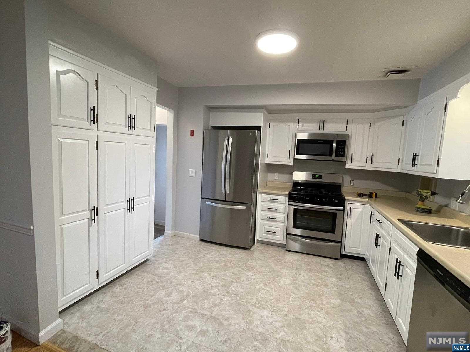 Immaculately maintained ranch home in the highly desirable neighborhood of Cresskill. 3BD 2.5BTH, beautiful gleaing hardwood flooring throughout. Upon entry a large window that brightens and warms the living room throughout the day. The kitchen holds a bountiful amount of wood cabinetry to fit all of your cooking needs, stainless steel appliances with open access to the dining room. All three bedroom are comfortably sized with closets to accommodate bedroom furniture or desk space. The generously sized fully finished basement offers additional entertaining/living space complete with wide plank flooring, exposed brick, and double windows with plenty of sunlight. The basement has a walk out patio that can accommodate a BBQ grill & outdoor furniture, and a side room which includes a sink for additional needs. The home has one attached garage with 2nd refrigerator. This welcoming home is located close to Cresskill and Closter town center. Landscaping by the LL Snow removal by Tenant