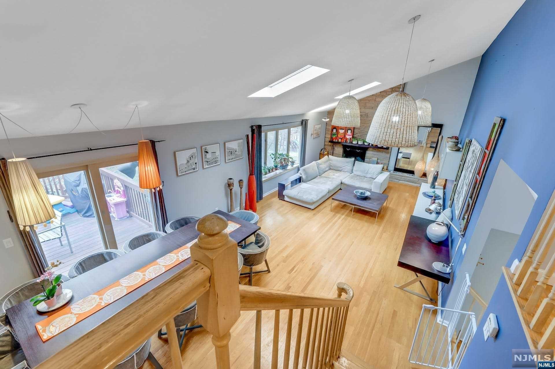 This delightful 4-bedroom, 3.5-bathroom Tri Level Split is perfectly situated in TENAFLY, on a Cul-De-Sac within a pedestrian range of Tenafly Middle and High Schools. Entering this modern open space, the house features a large family room and a huge living room with sky lights and a vaulted ceiling. The modern kitchen opens to the Living room, with fresh/modern updates, stainless steel appliances and, direct access to a large deck and a large fenced in yard that backs to other large backyards A few steps higher is a large master bedroom with an updated bath and two other bedrooms and a full bathroom on the same level. A few steps higher is a bedroom suite with a stunning loft perfect for your teen age son or daughter or a private home office A partially finished Walk-out basement serves as multi-purpose room. The attached two-car garage leads to the mud-room/laundry and only a few steps to the main level. Lastly...$14,745 in taxes....this gem won't last for long...