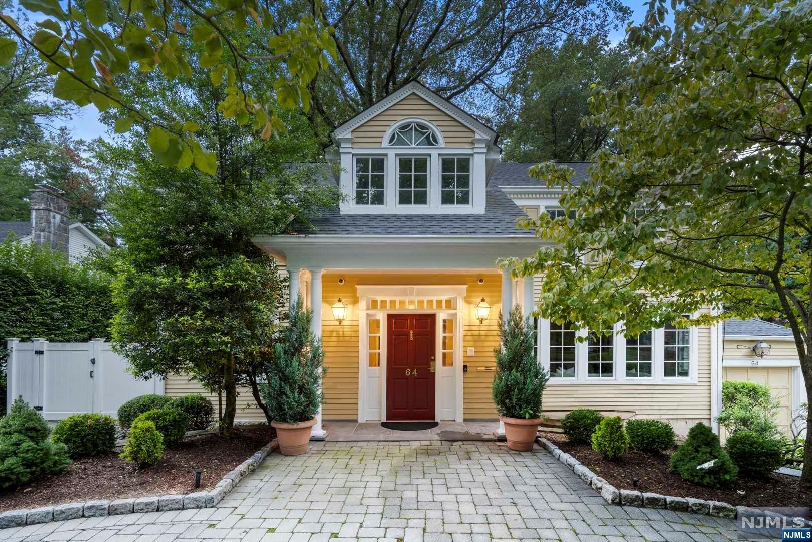 Tastefully Renovated 3,684 sq ft Center Hall Colonial nestled in the prime east hill of Tenafly. This home seamlessly blends suburban tranquility with urban convenience. The first floor boasts a center hall entry, elegant LR w/FPL, home office, formal DR leads into newly renovated gourmet MEIK w /top of the line appliances, sunny breakfast area seamlessly connects to the natural sun-filled FR w/ gorgeous views of outdoor space and expansive deck. The 2nd floor features 5 BR and 4 baths, includes luxurious primary suite w/ his & her separate baths & 2 WIC, mini bar, additional laundry in hallway bath, JR En-suite and 3 more BRs. The fully fenced-in spacious backyard features a playset, mini basketball court and deck/patio that make it perfect for entertaining. Multi-zone heat & C/A, C/V, elevator (svc 3 floors) and heated paver circular driveway, generator. Close proximity to NYC buses, house of worship, Smith Elementary School, David Johnson Park. Shows the pride of ownership
