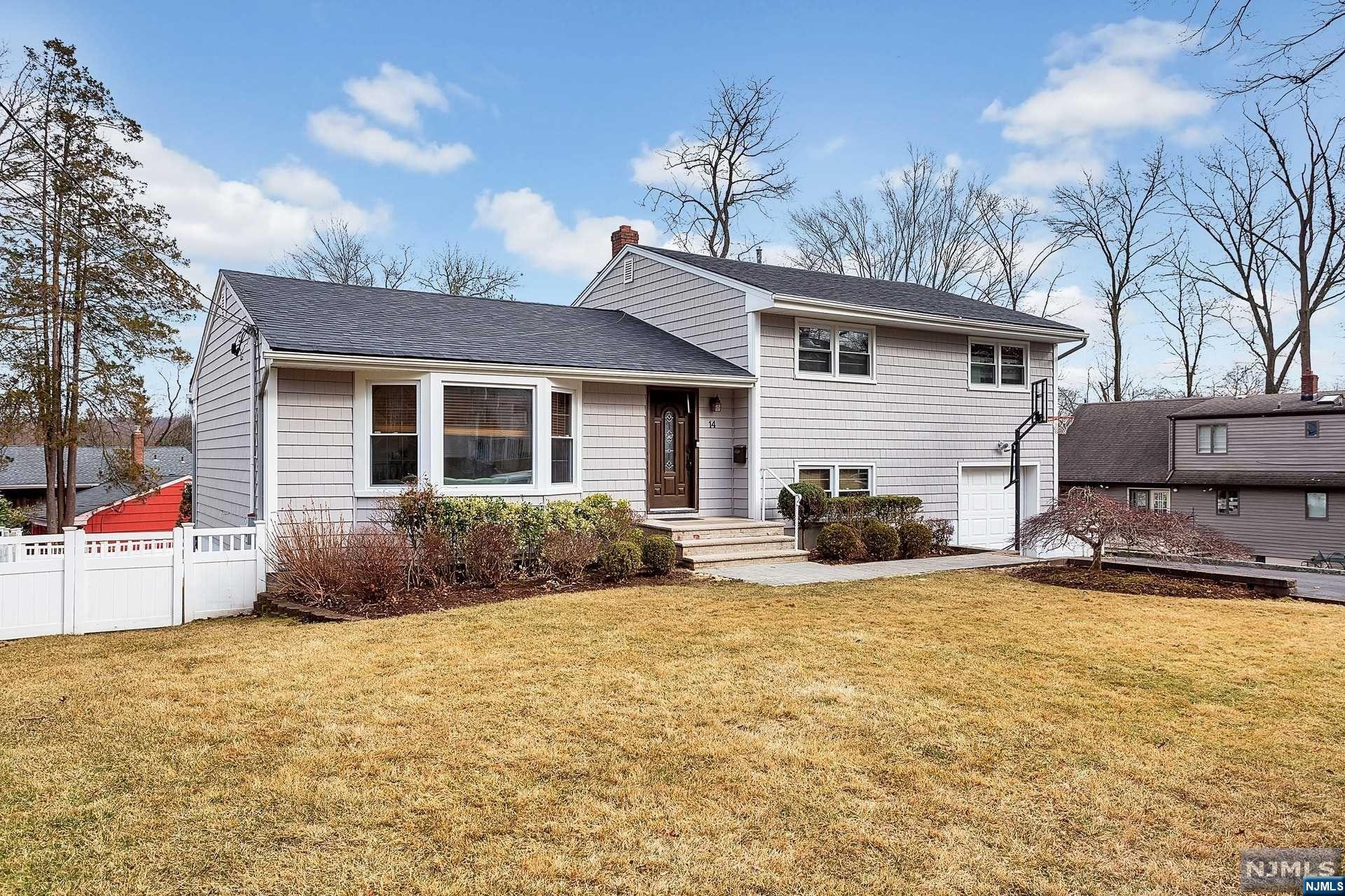 A fantastic four level split home on a quiet street with many great features, an excellent curb appeal, and tons of natural light. Hardwood floors throughout the house. 2 zone heat and c/a systems. The roof, the large open kitchen, and patio were all renovated just a few years ago. Spacious master suite with whirlpool, separate shower, skylights, and huge walk-in closet. A sliding glass door in the great room leads to the expansive patio and backyard. Conveniently located near NYC transportation and school.