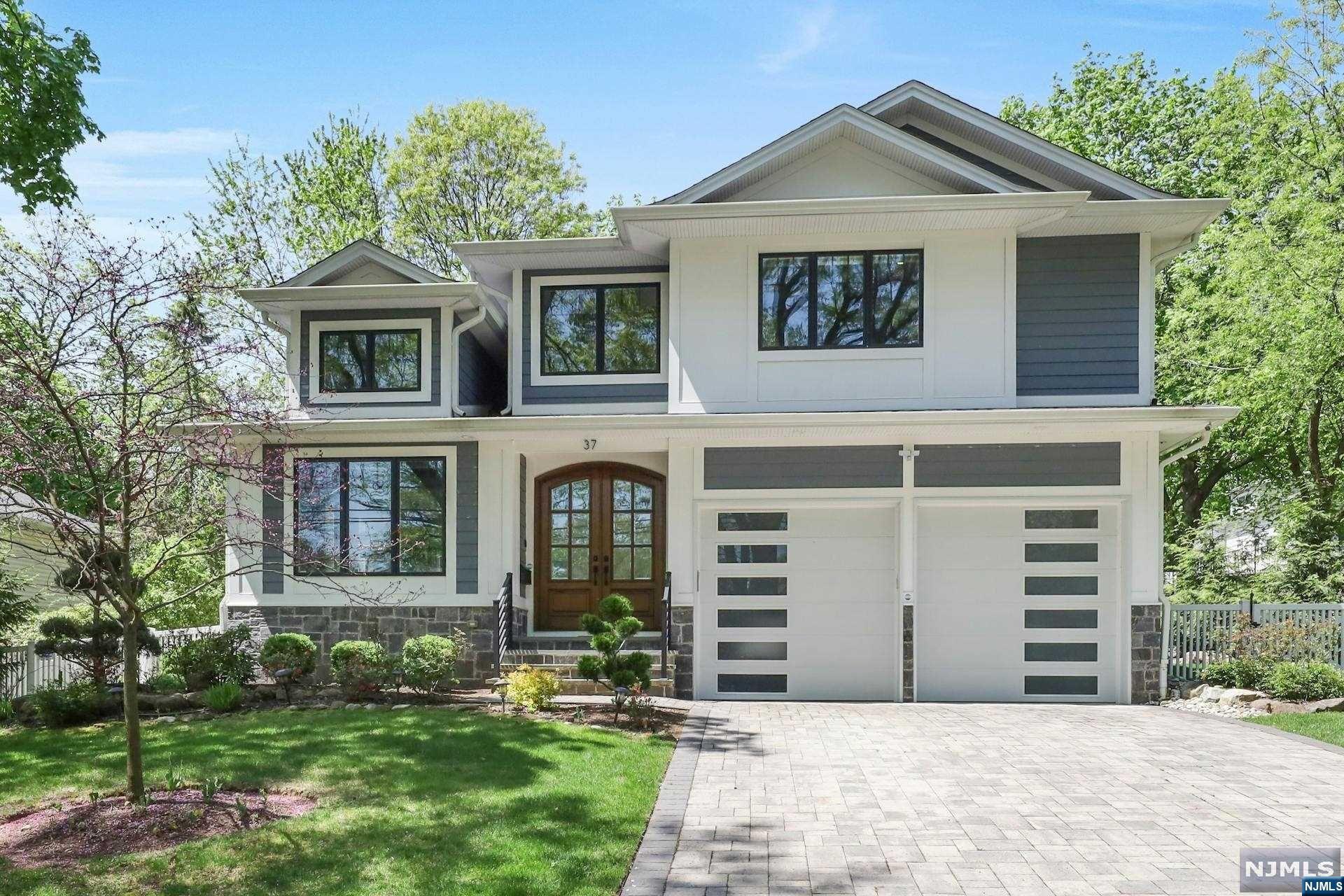 >>>Call Listing Agent Anat 201.341.4765 or Email: eisenberganat@gmail.com<<<
Stunning 6 yr young home, crafted by top-tier builders, awaits your personal touch. Nestled on a serene cul-de-sac., This home epitomizes luxury living. Blending elegance with functionality, it boasts an open-concept layout. The heart of the home is a bespoke chef's kitchen with premium appliances and a walk-in pantry. The expansive family room, adorned with a modern electric fireplace, flows into the dining and living areas, all graced by lofty ceilings. The chic powder room and mudroom enhance the first floor. Upstairs, discover the lavish master suite, featuring dual walk-in California Closets and a spa-like master bath. A private guest suite and two additional bedrooms, connected by a J & J bath, offer comfort and privacy. The laundry room is conveniently situated on the second floor. The lower level has a bedroom, playroom, wet bar, and a fully equipped theater. Experience the ultimate lifestyle with the lavish outdoor pool, waterfalls, kitchen, and fire pit. Walk to 166 bus to Port Authority.