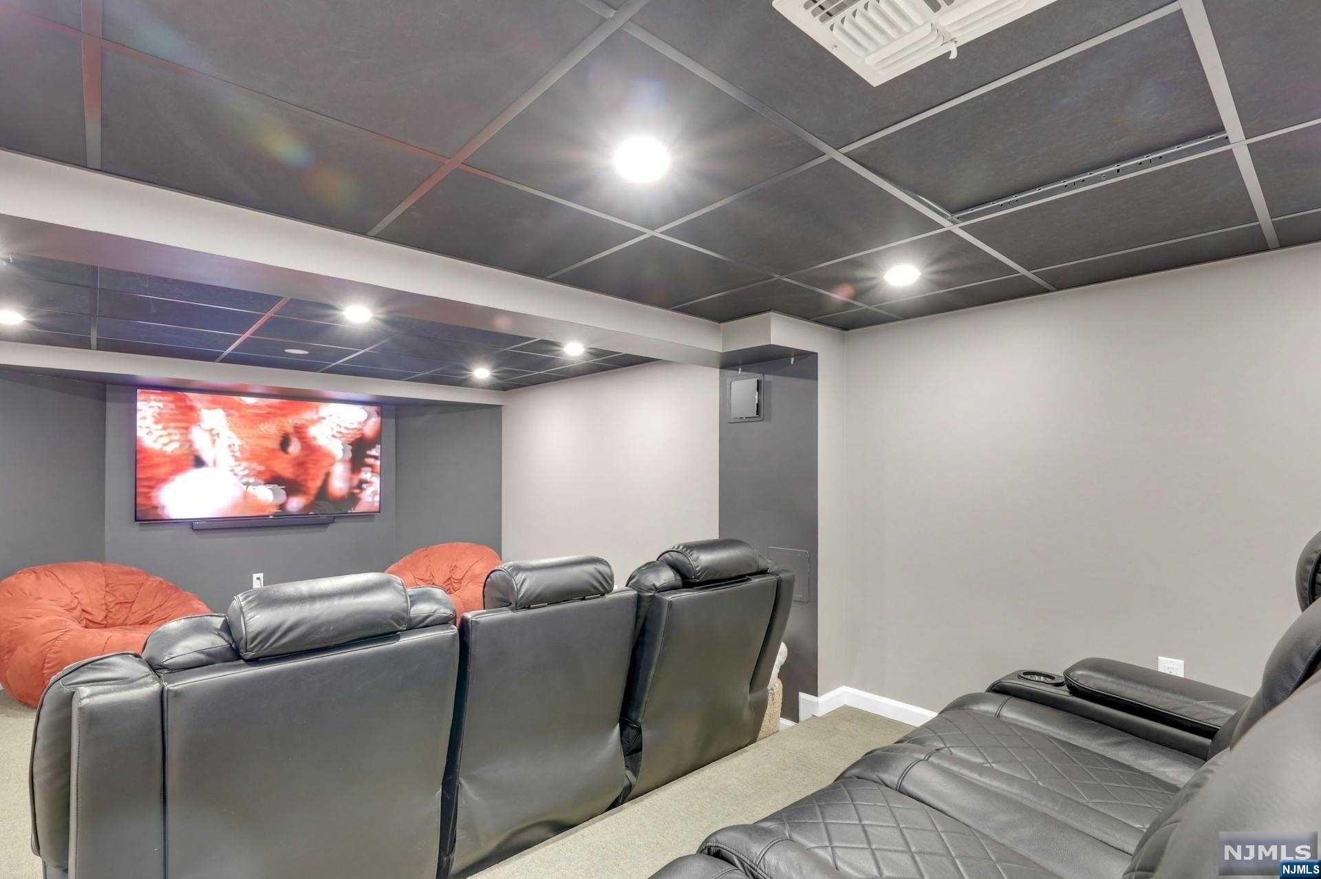 >>Call Listing Agent Anat 201.341.4765<<
Nestled in the heart of Tenafly’s East Hill area, this fully renovated home exudes modern luxury. Boasting 4 beds, 3 full baths, and 2 powder rooms, it offers a chef's grade kitchen opening to a family room, perfect for gatherings. A fireplace graces the living room, while a spacious dining room awaits formal occasions. An office on the first floor provides a dedicated remote work or study area.

The master suite dazzles with two walk-in closets and a radiant heated floor in the master bath. Upstairs, find another ensuite bed and two more sharing a bath alongside a laundry room.

The lower level hosts a theater and powder room for entertainment. Outdoors, enjoy a barbecue area and a covered patio with fans and heaters.

With proximity to schools, worship places, and transit, this home epitomizes comfort and convenience in Tenafly.

Ftankless hot water and newer AC systems.eatures include new hardwood floors, updated kitchen and bathroom, lavish outdoor living, 