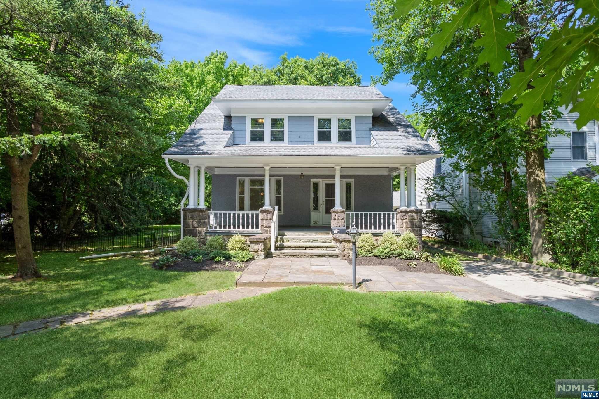 Classic, impeccably maintained Colonial-style home offers 4 bedrooms, 4 full bathrooms, a detached 2-car garage, and a sweeping backyard less than 15 miles from Manhattan, near top-notch schools, shopping, dining, parks, recreational areas, and major highways. The interior features hardwood floors, and exquisite trim work. A welcoming front porch brings you to a large foyer with a unique stained glass bay window. The open flow continues to the living room and a formal dining room flooded in natural light. The large eat-in kitchen is equipped with warm oak cabinetry, granite counters, and plenty of space! Off the kitchen is a full bathroom, sunroom, and a back stairway to the 2nd floor. Upstairs, the primary bedroom has an en suite bathroom and 2 large closets, while 2 additional bedrooms share a full hall bathroom. Up on the 3rd floor is a spacious 4th bedroom. The finished basement offers a generous space for recreation, exercise, or an office, full bathroom, & laundry.