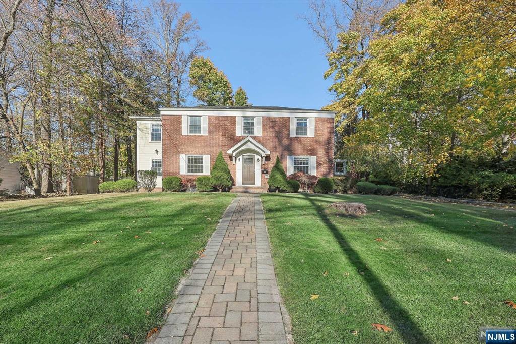 Located on a beautiful tree-lined street in the most sought-after residential neighborhood in Tenafly East Hill! Entire house was totally gut renovated in 2012 with extension. Modern kitchen and bathrooms. House faces south bringing in lots of sunlight. Hardwood floors throughout. First floor offers large living room w/ double-sided gas fireplace, kitchen w/ quality appliances, quartz countertop & heated tile floor, separate dining area & powder room. Second floor features large primary suite w/ full bath and walk-in closet, two additional bedrooms and full bath. Basement is fully finished with large multi-purpose room, laundry and storage room. Flat backyard is perfect for outdoor entertaining. Convenient location close to NYC bus transit, Smith School, parks & houses of worship.