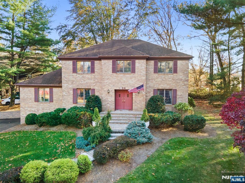 Welcome to Ramsey! Nestled at the base of a cul-de-sac, this beautifully maintained colonial has been thoughtfully updated by its original owners. The entry features elegant dental moldings and opens to a spacious dining room that flows into the stunning kitchen with high-end cabinetry, Sub-Zero fridge, double Wolf oven, and beverage fridge. The kitchen opens to a great room with vaulted ceilings and a wood-burning fireplace, plus a separate living room ideal for entertaining. An updated powder room and laundry complete the 1st floor. Upstairs, the primary suite offers a large bath and walk-in closet, with 3 additional bedrooms and an updated full bath with double vanity. The lower level features large windows and access to the oversized 2 car garage with newer doors. Outside, enjoy newer retaining walls, a private yard, spacious deck, and a full-house generatorâ€”make this your home today!WANT MORE INFO? CONTACT LISTING AGENT NICOLE MINETTI @ 201-388-0077/nicole@minettidennisgroup.com
