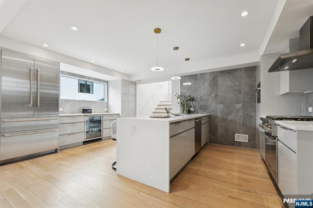 <b>CALL LISTING AGENT ANAT AT 201.341.4765</b> 

This breathtaking modern home is a masterpiece of luxury and functionality! Completely rebuilt, it boasts five bedrooms, five full bathrooms, and nearly 3,100 sq ft of perfection in a town celebrated with its blue-ribbon school, the exterior dazzles with Hardie Plank, striking porcelain tile accents & vertical cladding. High ceilings, skylights, and recessed lighting bathe the interior in natural light. The open-concept kitchen is a chef's dream, equipped with premium Thermador appliances. A few steps up is a spacious family room that leads to an incredible 500 sq ft deck with elegant porcelain pavers overlooking the serene backyard. The master suite is a private retreat with two walk-in closets and a spa-inspired bathroom adorned with Italian tiles. Relax and play in the recreation room, which features a sleek fireplace. Four bedrooms are ensuite with exquisite Porcelanosa/Italian tiles, complemented by a luxurious guest bath