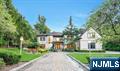 Experience the ultimate family retreat in Upper Saddle River, where elegance meets comfort in this quality-built home. Custom designed windows and millwork, special materials from Europe throughout, and the architecture speaks for itself. Designed for both relaxation and entertaining, the home features six spacious bedrooms-including two primary suites and an elevator servicing all 3 levels. The gourmet kitchen flows into the family room, leading to a beautiful bluestone terrace complete with an outdoor kitchen, perfect for gatherings. The impressive lower level offers a professional theater, bar, wine room, kitchen, gym, and sauna. Outside, the heated Gunite pool with a waterfall, swim-up bar, and open cabana with TV create the perfect entertainment setting, surrounded by a blue stone patio, and a large, lush lawn for outdoor activities. A magical place to call home.