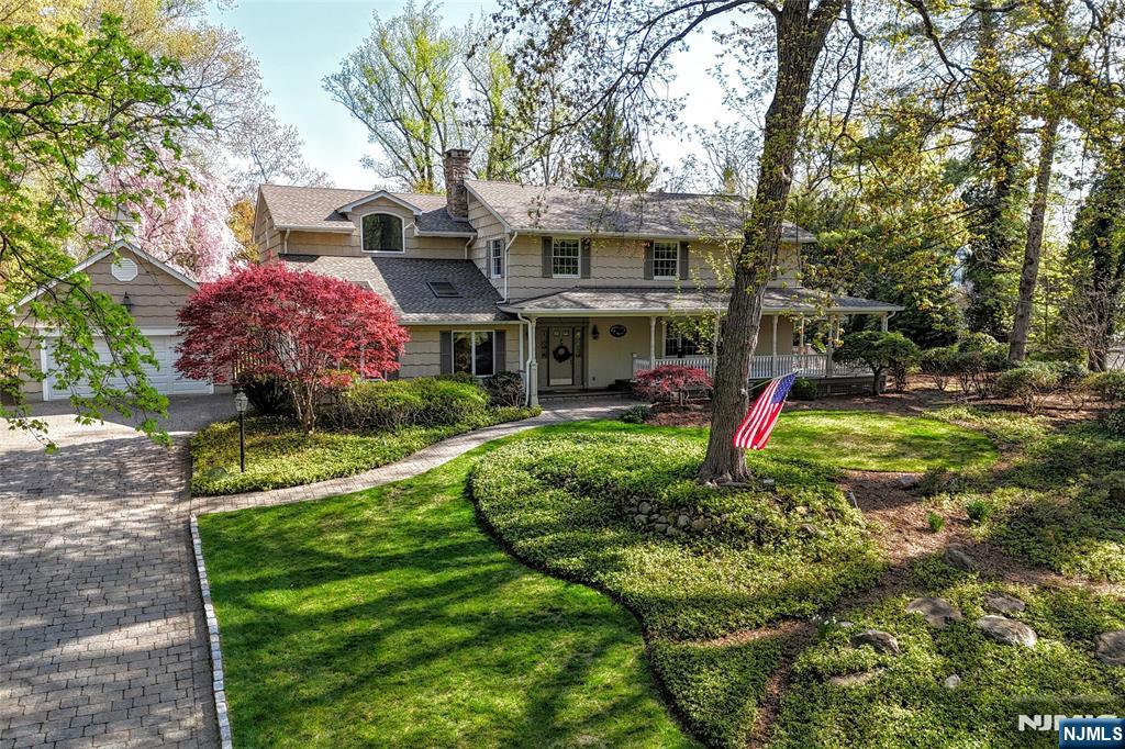WELCOME TO SAN J! This stunning 4-bedroom Colonial is in one of Allendale's most desirable neighborhoods. It's an entertainer's dream home which offers a backyard oasis. Enjoy mornings on the wrap-around porch, then step inside to a spacious first floor with a granite kitchen, family room, spacious dining room, great room, living room, 1/2 bath, and cozy reading area with built-ins and gas fireplace. Upstairs features 4 bedrooms, including a luxurious primary suite with radiant heat, jetted tub, steam shower, cedar closet and ample built-in closets. Another full bath with a separate shower and bathtub completes this level. Entertain in your own private backyard paradise with the in-ground pool or on the tennis/pickleball court with basketball. Pool cabana includes 1/2 bath. This well maintained home offers a full house generator, as well as a partially finished basement. Pool/tennis court/chimney is AS IS with no known issues. Well on property is used for Pool/Irrigation only.