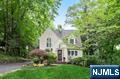 Embrace the warmth of a neighborhood that feels like home the moment you arrive! This picture-perfect colonial is in the prestigious Ridgewood Heights area, which offers NYC skyline views and close proximity to downtown shops, restaurants, and commuter transportation. The home blends timeless charm with modern living with its open layout, designer kitchen, and spa like baths (including one with sauna!). The spacious primary suite is a true retreat, and the walk-out, lower-level bedroom and full bath create the perfect hideaway for guests or residents in search of privacy. Imagine mornings filled with natural light pouring through your windows, afternoons spent strolling the tree-lined streets, and evenings hosting friends on your inviting, elevated deck surrounded by lush trees. 35 Ridge is where your ideal lifestyle unfolds!