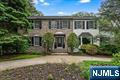 Move-in ready with major upgrades: new roof (2021), brand-new HVAC and A/C system (2024), and new skylights. Welcome to the stunning Center Hall Colonial youâ€™ve been waiting for! This fully updated 5-bedroom, 4.5-bath home offers approx 3,918 sq ft of beautifully designed living space that blends timeless elegance with everyday comfort. A grand two-story foyer opens to a spacious office with French doors and a formal dining roomâ€”perfect for work or entertaining. Continue into the expansive eat-in chefâ€™s kitchen with Sub-Zero refrigerator, Viking stove, Viking wine refrigerator, large breakfast area, and pantry. A powder room and formal living room with fireplace add charm, while the showstopping great room features soaring ceilings, custom built-ins, and a second fireplaceâ€”an inviting space for gathering. A first-floor laundry room completes the main level. Upstairs, the private primary suite offers a peaceful retreat with luxurious en-suite bath and two walk-in closets. A separate kidâ€™s wing with two bedrooms and a full bath adds privacy, along with two more bedrooms and another full bath. Each of the four additional bedrooms also has a walk-in closet. The finished lower level includes a family room, gym, bar, mudroom, and full bath. Outside: landscaped yard, circular driveway, two-car garage with EV charger, and extra storage. School bus pickup at the driveway. Short Distance to Park & Ride for easy NYC commute. Cal Eileen Seaman 201-906-8626 to see this beautiful