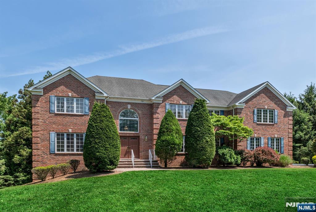 Stately brick colonial nestled on a quiet cul-de-sac, offering an exceptional floor plan. A grand two-story entry leads to a banquet sized dining room, formal living room & a sunken great room with soaring ceilings, skylights & a wood-burning fireplace. The spacious eat-in kitchen features a large center island, high end appliances & a slider to the newer Trex deck, perfect for entertaining. A large 1st floor office or den, laundry/mudroom, power room & access to the 3 car garage adds to everyday convenience. Upstairs youâ€™ll find 5 generous bedrooms, including a primary suite with 2 custom walk-in. closets and a junior ensuite with tray ceiling. The finished walk-out lower level includes a large rec room, full bath and possible 6th bedroom. Beautifully manicured property in a fantastic location with access to top rated schools, parks, shopping, transportation & more!