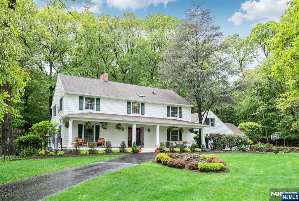 Discover tranquility, timeless charm, and exceptional privacy in this beautifully expanded colonial, nestled on a rare triple cul-de-sac in the sought-after North Gate section. Before stepping inside, enjoy the covered front porch, ideally situated to overlook the lush, mature landscaping that frames the circular driveway. Inside, the welcoming foyer is flanked by an office and a formal DR w/Fpl. Delight in the chefâ€™s kitchen, boasting custom rock maple Salerno cabinetry, high-end appliances, center island, wet bar, peninsula, and soaring vaulted ceiling, perfect for culinary creativity and casual gatherings. Or, unwind by the gas fpl in the inviting den or transition effortlessly into the sun-drenched 3-season sunroom, accessible from both the DR and den-ideal for seamless indoor-outdoor living and entertaining. There's more! A spacious Gr Rm off the kitchen + a full bth, PR/Lndry, and access to the grade level 3-car att garage. Upstairs, the primary suite offers a WIC and renovated bath. Three additional bedrooms share a thoughtfully designed Jack-and-Jill bathroom. A 2nd staircase off the Gr Rm leads to a flexible fifth br/bonus space- perfect for guests, a studio, or your next big idea! The partially finished LL offers even more living space. Upgrades include security system, generator, irrigation, siding, newer A/C system and more! Impeccably maintained and move-in ready. Close to ITC, Market Basket, and everything Franklin Lakes has to offerâ€”this home truly has it a