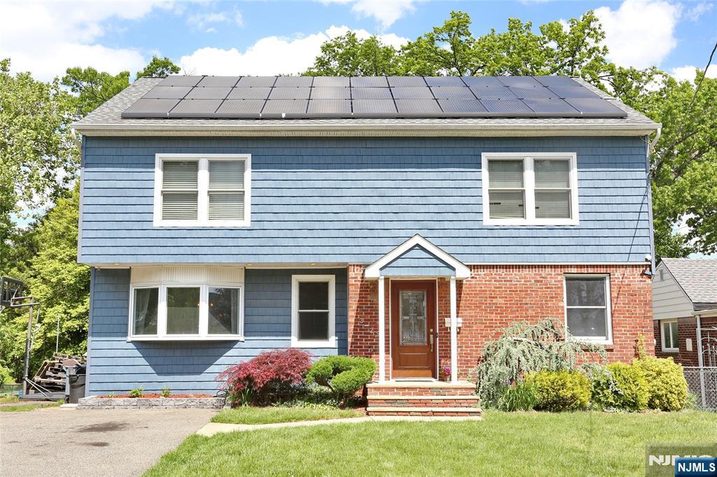 Welcome to this beautifully expanded home on a rare oversized fenced lotâ€”ideal for extended families or anyone seeking room to grow, entertain, and relax. Inside, you'll find a warm and inviting layout with hardwood floors, a bright open living space, and a sun-filled eat-in kitchen. The main level includes a full bath and bedroom, while upstairs offers two oversized bedrooms, a full bath, laundry room, and a private primary suite with a spa-like bath, double vanity, Jacuzzi tub, and massive walk-in closet. A large Walk-Up Attic offers a spacious bonus room, and the Finished Basement provides even more flexibility with three additional rooms, a full bath, and living areaâ€”perfect for guests or multi-generational living. Enjoy summer days in the saltwater solar-heated pool, plus the peace of mind of solar power, efficient heating/cooling, Reverse Osmosis water purification, and security systems. All just a short walk to houses of worship, top-rated schools, NYC train and bus lines, shopping, and parks. A truly special home in a great location!