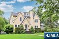 Neighborhood, architecture, and amenities come together in this pretty 5-bedroom, 3.5-bath colonial in the heart of Ridgewood! Close to top-rated schools, downtown, and NYC commuting options, the location could not be more convenient. Enjoy spacious, sun-filled rooms and a classic layout that spans four floors. Spend cozy evenings by the fireplace in the living room or host elegant dinners in the formal dining room. The updated kitchen opens to a warm family room with a fireplace and sliders to a large, private deck and patioâ€”ideal for outdoor entertaining. The beautifully landscaped backyard offers a peaceful retreat. Upstairs, you will find three bedrooms, including a serene primary suite with an en suite bath, while the third floor offers two additional bedrooms and a full bathâ€”an ideal teen escape or guest space. A must see!