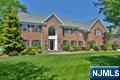 This one is a show stopper! Magnificent 5BR brick colonial with off-the-charts, exquisite backyard paradise, including saltwater pool w/infinity waterfall edge overlooking expansive, flat, field of a back yard, abutting acres of wooded town land, multi-level outdoor patio, outdoor kitchen, outdoor fireplace & pergola. Entertainment & private enjoyment paradise! This well-maintained home boasts many updates, custom finishings & beautiful built-ins. Kitchen renovation completed in 2015 including addition of Thermador 98 bottle wine refrig (2013), Subzero refrigerator & 2 Miele dishwashers. Gorgeous great room w/floor to ceiling windows, wood burning fpl & custom built-ins & coffered ceiling. Private office w/more built-ins, formal living room & dining room, 2 powder rooms & mudroom/laundry complete the first floor. Second floor has 5 true bedrooms including luxurious primary suite, dual walk-in closets, spa-like primary bath. Four additional bedrooms w/newer hardwood floors & built in custom closets, 2 full baths & balcony overlooking both the 2 story foyer & great room. Many updates to finished bsmt (2018). Lower level incl more built-ins, separate bar room w/pool table & wet bar, gym, sauna & full bath. New roof (2022), new HWH (2024), new front landscaping (2023), redone pergola (2021); A/C & pool equip replaced over last 7-10 yrs. Award winning schools. Too much to list. Truly a spectacular home and setting. Move right in and make this special paradise your own!