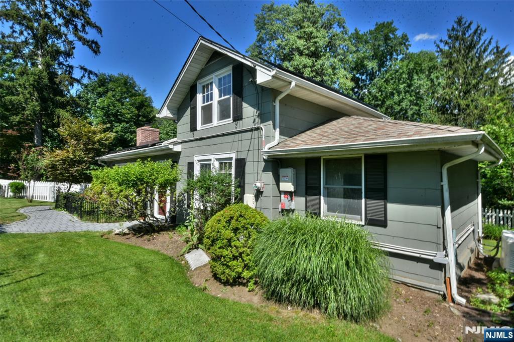 Welcome to this storybook cottage nestled behind a classic white picket fence in one of Ramseyâ€™s most sought-after neighborhoods. Brimming with charm and character, this private oasis is surrounded by mature perennial landscaping that creates a serene and secluded setting year-round. Inside, the home is flooded with natural light from multiple skylights, enhancing the warm and inviting atmosphere throughout. Thoughtfully updated, the kitchen and bathroom blend modern conveniences with timeless styleâ€”perfect for todayâ€™s lifestyle. Whether you're looking to downsize or seeking a great condo alternative, this home offers the perfect balance of comfort and simplicity. Located just minutes from downtown Ramsey, enjoy an easy commute, top-rated schools, and a vibrant community filled with year-round local events and activities. This is more than a homeâ€”itâ€™s a lifestyle. Come experience the charm and tranquility for yourself. Being sold As-Is