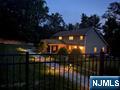Nestled on a quiet cul-de-sac, highly sought-after town of Upper Saddle River, this beautifully maintained 4-bedroom, 5-bathroom home offers the perfect blend of luxury, functionality, and suburban charm. Step inside to discover a spacious layout designed with comfort and entertaining in mind. The main level features a private first-floor primary suite with a full bath, a sunken living room, and a formal dining room adorned with extensive crown and custom moldings. The large eat-in kitchen boasts granite countertops, a center island, Bosch 5-burner cooktop, double oven, dishwasher, counter microwave, and sliding glass doors that lead to a lovely paver patio. Second floor features 3 large bedrooms, laundry room with natural sunlight. The home is equipped with modern amenities including a 2-zone HVAC system, central vacuum, MusicCast surround sound, cable and fiber-ready ethernet ports, and two fireplaces for cozy evenings. The finished basement adds even more functional space, perfect for recreation or a home office. Outdoors, professionally landscaped enjoy a recently renovated gunite heated pool with LED lighting and a 10-person heated spaâ€”an entertainerâ€™s dream. A large 2-car attached garage EV Charger and a spacious driveway with room for 6 additional vehicles complete the package. Located within a top-rated school district and close to houses of worship, parks, shopping, and transportation, this home delivers both convenience and a wonderful lifestyle.