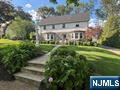 Exceptional Center Hall Colonial in Ridgewoodâ€™s Coveted Willard School District. This impeccably maintained Center Hall Colonial is ideally situated just two blocks from Willard Elementary School in Ridgewoodâ€™s highly sought-after Willard District, blending timeless elegance with thoughtful updates. Featuring 4 bedrooms and 3.5 baths, this home offers a rare combination of charm, craftsmanship, and design. At the heart of the home is a show-stopping kitchen designed for entertaining, boasting 9'5" ceilings, Grasshopper Green Waterworks cabinetry with icebox hinges, a custom bar with beverage refrigerator and polished nickel shelving, and a stunning 9' x 6' Calacatta marble island. Floor-to-ceiling custom windows and doors flood the space with natural light and provide seamless access to the outdoors. Spacious formal living room with marble fireplace surround, a family room with vaulted ceilings, and a formal dining room with custom built-in bookcases, grasscloth wallpaper, and a vintage Emil Stejnar starburst chandelier. A renovated basement offers a full bath and laundry room. Other features include a custom-built mudroom and generous powder room.Upstairs, the primary suite features a full bath and walk-in closet, while three additional bedrooms and an updated hall bath provide ample space for family or guests. Owner has NJ Real Estate License. Contact Jeff Feagles at 201-803-9624 for more information or to schedule a showing.