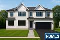 Welcome to 90 Delmar Ave, Glen Rock, NJâ€”a masterpiece of modern living crafted by one of the top builders in the area. This newly constructed residence stands proudly on a new foundation, offering an exceptional blend of luxury and functionality. With six spacious bedrooms and four and a half bathrooms, this home is designed to accommodate both intimate family gatherings and grand entertaining. Step inside to discover a two-story family room that serves as the heart of the home, providing an inviting space for relaxation and connection. The chef's kitchen is a culinary dream, equipped with premium Sub-Zero and Wolf appliances, ensuring every meal is prepared with precision and style. The large primary suite is a private retreat, featuring a spa-like bathroom and his-and-her closets, offering unparalleled comfort and convenience. For entertainment enthusiasts, the property boasts a state-of-the-art movie theater and a basement bar, perfect for hosting movie nights or casual get-togethers. Fitness lovers will appreciate the dedicated gym space, allowing for workouts in the comfort of your own home. Every corner of this residence reflects designer finishes, showcasing the builder's commitment to quality and attention to detail. The location in Glen Rock provides a serene suburban setting while maintaining proximity to essential amenities and transportation options. Close proximity to Coleman elementary school and the HS/Middle school.