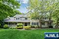 Welcome to your forever homeâ€”where curb appeal, timeless design, & stylish space is awaiting! Built in 2005 & located on a cul-de-sac, this irresistible stone-front Colonial offers 4 bedrooms plus office, 3.5 baths & almost 4000 SF of easy living! A storybook front porch with enchanting swing greets you & welcomes you into the 2-story foyer. Inside, the home unfolds into a sun-drenched living room with oversized windows, a dining room with wood floors, & a grand great room with vaulted ceilings, stone fireplace, & a wall of windows that draws the outdoors in. The beautiful eat-in kitchen is impressive with a center island, stainless steel appliances, a walk-in pantry, and an inviting dining area with glass doors that open to rear yard. Need a dedicated home office? The first-floor layout includes a private room perfect for flex space. A custom mudroom & direct access to the 3 -car garage is next along with a powder room. Upstairs, escape to your serene primary suiteâ€”an expansive 2 room sanctuary complete with a vaulted ceiling, sitting room or nursery (with laundry room) a spacious bath, & walk-in closet. 3 additional bedrooms and 2 full baths provide room for everyone. The finished lower level extends your living space with a rec room & gym. Step outside to the fenced backyard featuring a patio, mature plantings, and privacyâ€”ideal for hosting or unwinding. With alluring curb appeal, updates & generous space, this is a true Wyckoff gem!