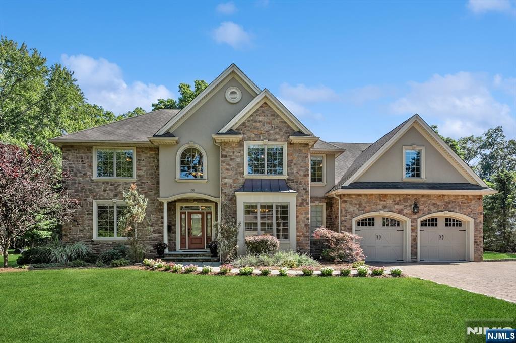 Spacious, sun-filled 2013 Colonial on a beautifully maintained .75-acre lot (199 x 165) offering over 4,500+ sq ft of living space, not including the fully finished basement. The first floor features a bright and open layout with a grand entry foyer, bedroom and full bath, laundry room, and a gourmet eat-in kitchen with a 43"x95" marble island, stainless steel appliances, and access to the backyard patio through the formal breakfast room. Hardwood, marble floors, and high ceilings throughout add elegance. Upstairs boasts five generously sized bedrooms, including a luxurious primary suite with a spa-like bath, walk-in closet, and a versatile bonus room, plus two additional full baths and attic access. The fully finished basement is dry and carpeted, featuring a bonus room and a large utility roomâ€”perfect for recreation, gym, or storage. The spacious backyard offers potential for a pool or tennis court. Lovingly maintained by original owners with attention to all utilities. Express NYC bus to Port Authority, parks, and schools are just steps away. Move-in ready and like new! Don't miss this one!