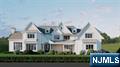 An absolute masterpiece of modern luxury, this brand-new dream home is being built by renowned developer Tru Habitat. Spanning 10,000+ sq ft of meticulously crafted living spaces, it offers 7 bedrooms, 6.5 bathrooms, & every high-end feature imaginable. Professionally designed with a curated blend of timeless elegance & modern sophistication, it showcases exquisite finishes, designer lighting, custom millwork, & a seamless floorplan. Show-stopping chefâ€™s kitchen with additional prep kitchen is outfitted with top-of-the-line Sub-Zero/Wolf appliances. The grand primary suite features a fireplace, private sitting room, oversized WIC with 2 center islands, & a spa-inspired bath w. radiant heated floors. Additional highlights include 2 laundry rooms (1st & 2nd floors), a 3-car garage, & an amenity-rich lower level with theater, gym, guest suite, & expansive rec room w. wet bar. Private backyard oasis features a custom gunite saltwater pool, hot tub, & covered patio. Set on over 1 acre backing up to Saddle River, the property offers exceptional privacy with preserved wooded land that will never be developed. Located in sought-after Ho-Ho-Kus with top-ranked schools, a charming downtown, & convenient NYC access, this home is the perfect blend of luxury & lifestyle.