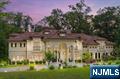 Discover 6 Burning Hollowâ€”a stunning European-inspired custom built estate nestled on a private street in the prestigious Saddle River. This 10,000+sqft architectural masterpiece offers 6 spacious bedrooms, 7 full and 3 half baths situated on approximately 2 private acres. From the soaring grand foyer and sweeping staircase to the richly detailed living and dining spaces, every inch reflects timeless elegance. The gourmet kitchen features ornate cabinetry, a large island, and a sun-drenched breakfast nook overlooking the indoor pool. The true showstopper: a dramatic two-story indoor pool sanctuary with cascading waterfalls, private grotto and resort ambiance. Elevator access, exquisite domed ceilings, and lavish entertaining spaces complete this exceptional residence.