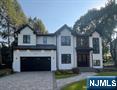 Stunning New construction in the Heart of Glen Rock offering approx. 5,300 Sq ft of luxurious living across 3 beautifully finished levels. This 6-bedroom, 5.5-bath home impresses with soaring 10â€™ ceilings, grand two-story foyer, and a bright open-concept layout ideal for entertaining. The main level features a formal dining room, expansive great room with quartz gas fireplace, and a chefâ€™s kitchen complete with premium appliances, breakfast nook, and a fully outfitted butlerâ€™s pantry. A guest suite with full bath, designer powder room, and built-in mudroom complete the first floor. Upstairs offers 9â€™ ceilings, 4 spacious bedrooms including a stunning primary suite with tray ceiling and rail lighting, custom his/her closets, and a spa-inspired bath with heated floors, freestanding soaking tub, and dual-head shower. The fully finished lower level includes a glass-enclosed gym, wet bar with wine fridge, large rec room, guest suite, and bonus room. Designer trim work throughout includes boxed ceilings and custom wall moldings. The exterior boasts Hardie siding, Azek trim, Andersen 400 windows, paver driveway and patio, fenced yard, and sleek architectural roofing. Smart home features include Ring cameras, centralized vacuum, 2-zone HVAC, and more. Located close to NYC transit and top-rated Blue Ribbon Schoolsâ€”this home has it all!