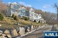 Rare opportunity where privacy abounds,3.38 acres estate, overlooking Franklin Lake, in the highly sought after South Gate Urban Farms, on one of the most coveted streets in all of Franklin Lakes. Be the first to love this stunning 8000+ sf custom 5-bedroom house which was built for entertaining and has magnificent views from almost every room in the home. Designed with beautiful architectural details a grand entry foyer, soaring 38' ceiling, floor-to-ceiling windows and striking curved staircase. This light-filled home has amenities galore including a 1200 sf primary bdrm suite w/ dual WICs, wine bar/cellar w/ French doors to veranda overlooking the lake, gym, sauna, steam shower, elevator, laundry on 2 levels, mud room & EV wired 3 car heated garage. The chef inspired kitchen includes a 60' Wolf range, Subzero fridge, 2 Miele dws,15' island & working pantry. The main level spills out to the patio with Gunite pool, spa and cabana. Seller holds NJ RE license