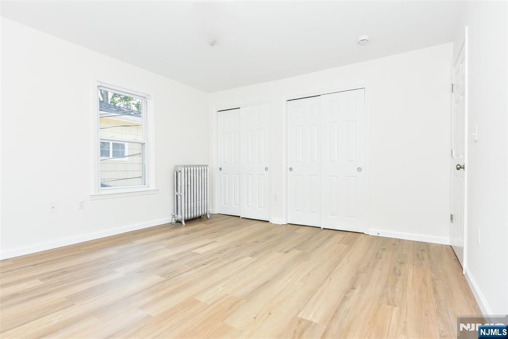 BEDROOM WITH DOUBLE CLOSETS