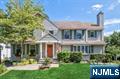 Move right in to this beautiful 5-bedroom, 3.5-bathroom center hall colonial located on a cul-de-sac in one of the most sought after neighborhoods in town. Loaded with natural light, the main floor offers wonderful flow and details throughout including a two story entrance foyer, large living room with gas fireplace and built-ins, den, first floor bedroom, updated bathroom, modern eat-in kitchen and a large dining area that opens to a recently renovated deck perfect for outdoor entertaining. The second floor offers a newly renovated hall bathroom, four generously sized bedrooms including a primary suite with high ceilings accented by reclaimed wood beams, a gas fireplace, spacious walk-in closet and spa-like bathroom. The fully finished walk out basement offers plenty of additional rec space, half bath and storage. Enjoy the very private backyard which features a gorgeous modern pool surrounded by lush gardens and mature landscaping. Close to top-rated town school, convenient to downtown and NYC transportation.