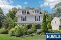 Welcome home to this beautifully renovated colonial in the heart of top rated Ho-Ho-Kus. With stunning moldings and new hardwood floors throughout, this home perfectly blends classic charm with modern comforts! An inviting lemonade porch welcomes you into the formal living room with a cozy gas fireplace. The elegant dining room, featuring French doors, opens to a bright eat-in kitchen. Another set of French doors leads to the spacious family room creating seamless transitions for entertaining or quiet nights in. A private office, convenient laundry/mudroom and stylish powder room complete the 1st floor. The second level features three generous sized bedrooms and a full bath. The third floor is a serene private retreat with the primary bedroom, massive walk-in closet and luxurious en-suite bath. The versatile fifth bedroom offers endless possibilities - nursery, bedroom, or a second work space. Downstairs, the finished basement offers dual spaces perfect for a gym, rec room, and/or playroom. Step outside to a beautifully landscaped, fully fenced rear yard with privacy trees and a paver patio, perfect for outdoor entertaining. An oversized detached garage and lush rear lawn add convenience and charm. Can't beat the proximity to downtown shops, dining, parks, train, and the award winning HHK school! Don't miss this opportunity to live in one of the top rated towns in NJ!