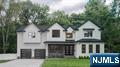 Nestled along the Ridgewood border is this impressive, brand-new construction masterpiece that has become part of the modern luxury in Glen Rock. Another masterfully built home by Skill Custom Homes quietly reflects true interior design vision & high-end craftsmanship. A Colonial style home, on existing foundation, showcases a cohesive floor plan with 10â€™ ceilings, white oak flooring & an exquisite switchback staircase. Bluestone Cambridge paver driveway. Direct access 2-car garage with soaring ceilings. Chefâ€™s kitchen is a showstopper with white cabinetry, Sub-Zero/Wolf/Miele appliances & a 10' island with waterfall Calcutta Gold Quartz. A 2-story foyer, great room with FP, formal living & dining areas offer a seamless flow for living & entertaining. Opulent design touches, layered textures, & curated finishes elevate every space with timeless elegance. The luxurious primary en-suite features 2 WICs & a spa-like bath with a huge glass shower, soaking tub & double vanity. The 2nd en-suite has a tray-ceiling, linen closet, and frameless shower doors. The 3rd & 4th bedrooms share a Hollywood bathroom with double sinks and a water closet. The finished lower level is perfect for a gym, rec-room, or guest suite. Glen Rock offers top-rated schools, including a blue ribbon elementary school, a vibrant downtown, train service to NYC, and a walkable community, making it one of Bergen Countyâ€™s most cherished towns to call home * OPEN HOUSES * SAT Aug 23 & SUN Aug 24 from 3pm -5pm