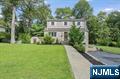 Move right into this beautifully updated 4-bedroom, 2.5-bath Colonial, perfectly situated on a quiet residential street just moments from downtown Allendaleâ€™s shops, restaurants, and transportation. Nestled at the end of the block, this home offers exceptional privacy. The main level features a true open-concept layout with a spacious living room, dining area, and modern kitchen with quartz countertops and ss appliances, plus a sun-drenched family room with sliders to a newly updated deck and private backyard with a large new custom Shed. A bedroom/home office and full bath complete this level. Upstairs, youâ€™ll find three generously sized bedrooms and a full bath, while the finished lower level offers the perfect recreation room, a powder room, tons of storage, and access to the one-car garage. Hardwood floors run throughout the main and second levels.