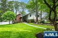 Completely renovated 4-bedroom, 2.5-bath contemporary home set on a lush, park-like acre in prestigious Upper Saddle River with a beautiful in-ground pool & backyard. Stunning finishes inside and out. Step into the welcoming entrance foyer and continue along to the large Living Room with vaulted ceilings & fireplace. Elegant Dining Room. Gourmet Kitchen outfitted with high-end Sub-Zero and Wolf appliances plus quartz countertops. The Primary Bedroom offers a serene retreat with a walk-in closet and en-suite bath. Additional bedrooms are spacious and bright. On the ground level, a finished bonus room with a private entrance makes an ideal Rec Room, home office, or gym. The finished basement expands the living space with a huge recreation room and abundant storage. Built-in speaker system inside and out, security cameras, and an attached 2-car garage with direct access. A large driveway accommodates multiple vehicles. Step outside to enjoy the stunning outdoor spaces, including a large patio, fire pit, 1/2 basketball court, and fenced-in pool area with spa-like ambiance, surrounded by lush landscaping. Conveniently located near major highways, shopping, & top-rated schools.