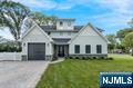 Stunning new construction home built on an existing foundation, nestled in the highly sought-after community of Glen Rock, New Jersey. This exquisite residence offers approximately 3,600 square feet of thoughtfully designed living space, not including the expansive basement, providing ample room for comfort and functionality. Upon entering, you are greeted by an open layout that seamlessly connects the living, dining, and kitchen areas, creating an inviting atmosphere perfect for both everyday living and entertaining. The home office is a valuable addition, catering to the needs of today's remote work lifestyle. The property boasts five generously sized bedrooms and four well-appointed bathrooms, ensuring space and privacy for all family members. The highlight of the home is the huge primary suite, featuring a luxurious walk-in closet that offers abundant storage and organization options Outdoor living is equally impressive, with a covered patio space that serves as an ideal setting for outdoor entertaining or simply enjoying a quiet evening. The home's location is unparalleled, offering close proximity to top-rated schools, beautiful parks, and convenient transportation options, making it an ideal choice for families and commuters alike. 209 Cornwall Road is a perfect blend of modern design and practical living, set in a prime location that provides both tranquility and accessibility. Schedule your private showing today!