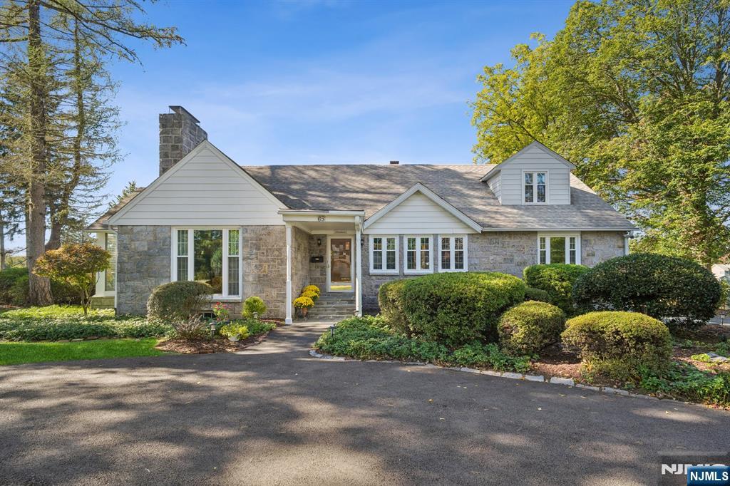 Spectacular views and golf course access! There are only so many homes in the Ramsey Golf and Country Club that have this kind of view and access to the private golf course, and this is one of them. Being offered for the first time in 45+ years, this charming 4 BR, 3 BA Expanded Cape beside the 15th tee box has stunning western exposure in a location that can't be beat. Step inside and discover a home that has almost 3000sf, filled with character and potential. An entry foyer leads you to a large formal living room with fireplace, formal dining room and a sun porch, a perfect spot to enjoy a book. The eat in kitchen has sliders to the back patio and sweeping views of the golf course and lake. Down the hall are two bedrooms, a large full bath and a cozy den that could be transformed into a bedroom or office. The 2nd level has 2 large bedrooms, a full bath and lots of storage. The huge basement is partly finished with a fun bar and fireplace, laundry and a sauna where you can warm up after a golf round in the chilly air. Enjoy morning coffee on the patio with peaceful views, meet friends at the clubhouse, pool, or first tee, or stroll into downtown Ramsey for shopping, dining, and access to the NYC train â€“ all just minutes from your door. RGCC is a unique community with a brand new, elegant clubhouse, 18-hole golf, pool with open air bar, paddle tennis/pickleball, kayaking, social events for all ages and much more. Donâ€™t miss this chance.