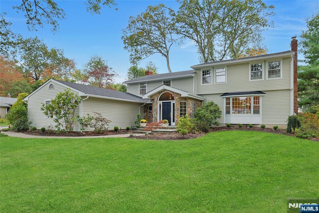 Spectacular 5 BR/3FB/1HB expanded split w/colonial flare. Close proximity to town, shops, schools, highway and train. This updated, spacious home boasts an amazing front entry stone vestibule w lots of natural light and vaulted ceiling. Gourmet kitchen w/top of the line appliances including Wolf, SubZero & Bosch, large center island w/seating for 8, bar area w/beverage fridge, roll up appliance garage, spacious breakfast area with large panoramic windows and FR seating area with access to outdoor patio w fire pit. Large formal DR room/fpl, elegant formal living room just two steps down with/fpl. Updated mudroom/laundry w/access to back yard. Updated full bath on 1st floor. Light filled office with built-ins and french doors just off LR. Second level boasts 4 large bedrooms, 1 BR w updated 1/2 bth en-suite, updated full bth, and large Primary bdrm suite w/WIC, spa-like private bath w/dbl vanity. Fin. basement as addl rec room. 3 Car Garage. Award winning schools, beautiful parks and recreation.