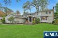 Spectacular 5 BR/3FB/1HB expanded split w/colonial flare. Close proximity to town, shops, schools, highway and train. This updated, spacious home boasts an amazing front entry stone vestibule w lots of natural light and vaulted ceiling. Gourmet kitchen w/top of the line appliances including Wolf, SubZero & Bosch, large center island w/seating for 8, bar area w/beverage fridge, roll up appliance garage, spacious breakfast area with large panoramic windows and FR seating area with access to outdoor patio w fire pit. Large formal DR room/fpl, elegant formal living room just two steps down with/fpl. Updated mudroom/laundry w/access to back yard. Updated full bath on 1st floor. Light filled office with built-ins and french doors just off LR. Second level boasts 3 large bedrooms, 1 BR w updated 1/2 bth en-suite, updated full bth, and large Primary bdrm suite w/WIC, spa-like private bath w/dbl vanity. Fin. basement as addl rec room. 3 Car Garage. Award winning schools, beautiful parks and recreation.