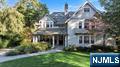 Custom-built in 2008, this exceptional home offers over 7,500 sq. ft. of thoughtfully designed living space across four levels, set on nearly three-quarters of an acre. A cedar shake roof, copper gutters, and stone retaining walls enhance the homeâ€™s timeless curb appeal and architectural integrity. Exquisite millwork and custom detailing are showcased throughout. The main level features elegant formal and casual spaces, including a dining room designed for holiday entertaining and a large family room with fireplace, custom built-ins, and French doors opening to the back terrace â€” creating an ideal flow for indoor and outdoor entertaining. Upstairs, the luxurious primary suite provides a private outdoor escape â€” a serene retreat for morning coffee or evening relaxation. Four additional bedrooms, including one en suite and two connected by a Jack and Jill bath, offer generous accommodations. A second-floor laundry room adds convenience. The walk-out lower level provides additional living space with a family room and stone fireplace, game room, gym, full bath, and massive pantry. The expansive back porch overlooks the spectacular property, complete with a stone fireplace. The backyard oasis features a gunite pool, professionally landscaped grounds, and an oversized lawn â€” perfect for outdoor living and play. Purposefully designed and meticulously maintained, this home blends timeless craftsmanship with modern functionality â€” offered for the first time.
