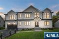 Experience Modern Luxury Redefined in this Stunning New Construction, ideally located in the highly sought-after town of Glen Rock. This impressive Colonial, rebuilt on an existing foundation, showcases charm & detail with white oak floors & exquisite designer details & lighting. The show stopping chefâ€™s kitchen features custom cabinetry, Thermador appliances, a prep pantry with additional cabinetry & refrigerator space, and a beautiful Taj Mahal waterfall island opening to the dining & family roomâ€”perfect for entertaining. A convenient first floor bedroom en-suite offers flexibility for guests or can be utilized as a home office. Upstairs, the spacious luxurious primary suite offers vaulted ceilings, two large walk-in closets, and a spa-inspired bath with soaking tub and oversized glass shower. Additional bedrooms include a private ensuite bedroom as well as 2 bedrooms with a shared Jack & Jill bathroom as well as a large laundry room. The finished lower level offers flexible space for a gym, rec room, or guest suite with a convenient full bathroom. With a paver patio, 2-car garage, large driveway, and proximity to top-rated schools, downtown, and NYC transit, this home blends refined living with effortless sophistication. Don't miss this Opportunity.