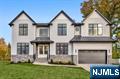 Welcome to 11 Garvey Place, a luxury new construction masterpiece in one of Bergen County's most sought-after towns. Designed by a renowned local architect, every detail of this 6-bedroom, 5.5-bathroom home is set to reflect high-style interior design aesthetics & quality craftsmanship. Set on a 80x140 lot, this grand center hall colonial showcases a flawless floor plan with 10' ceilings, plus 2-story living spaces, gleaming hardwood floors, oversized Anderson windows, and exceptional attention to detail throughout. At the heart of the home is an open layout consisting of a chef's kitchen with top-of-the-line Sub-Zero/Wolf appliances, an oversized center island, and quartz counters, overlooking an integrated secondary dining space, and a 2-story great room with a fireplace. A two-story foyer, formal dining & living rooms & 1st floor guest ensuite offer seamless flow and everyday comfort for living & entertaining. The primary suite features a walk-in closet & a spa-like bath with a large shower, soaking tub, and double vanity. The finished lower level includes a gym, rec room with a kitchenette, wine cellar, & egress bedroom and full bath. Enjoy an exceptionally designed home all while being in convenient proximity to top-ranked schools, shops, and parks in one of New Jersey's top commuter towns!
